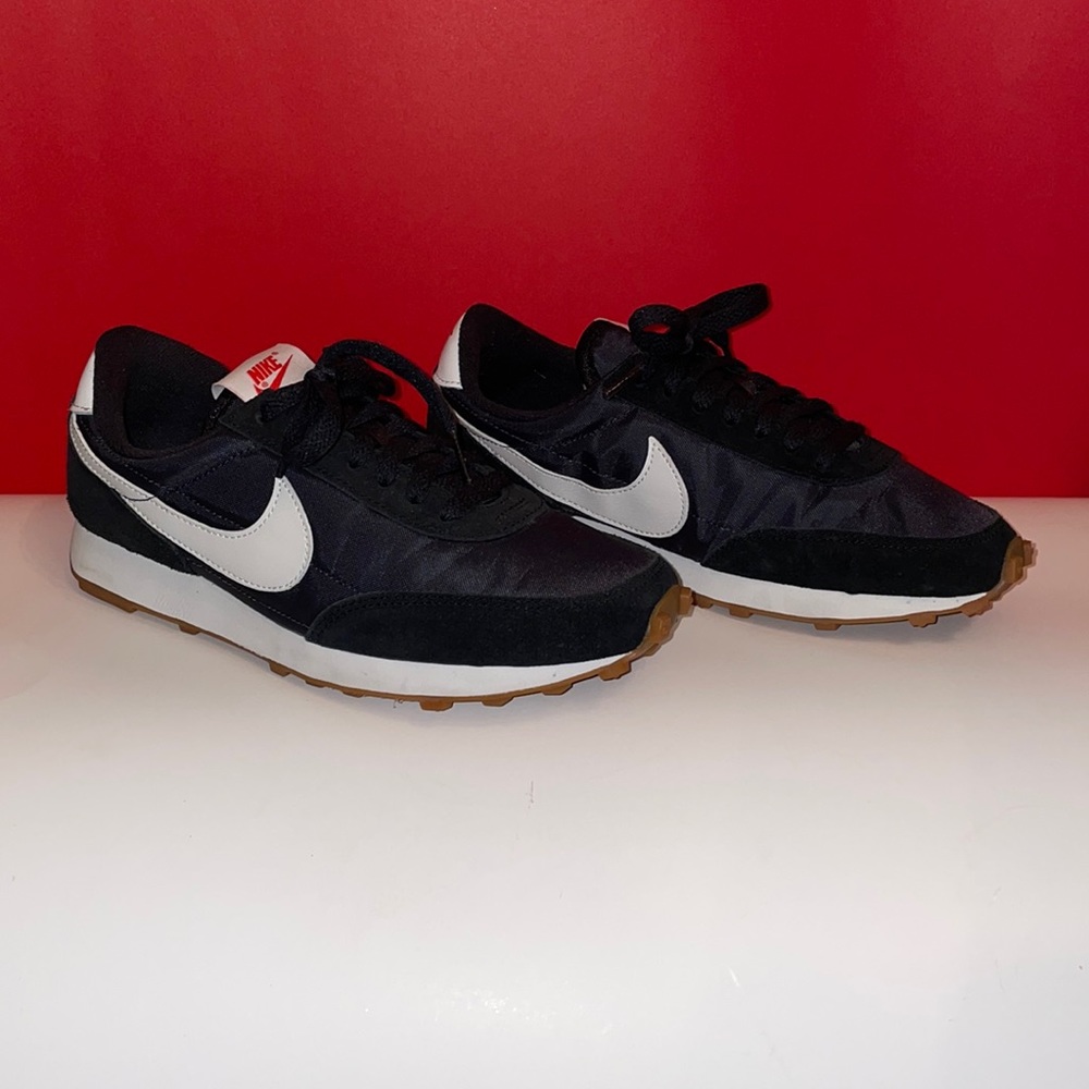 Red, white, and blue Nike Daybreak sneakers